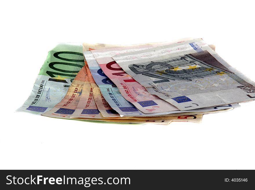 An isolated shot of Euro banknotes in all sizes. A lot of white space for text. An isolated shot of Euro banknotes in all sizes. A lot of white space for text.