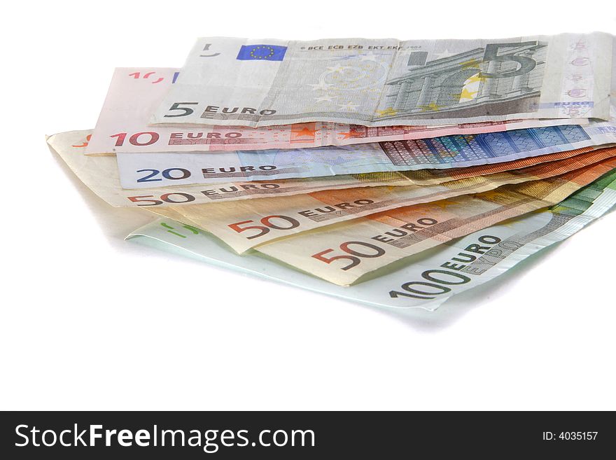 An isolated shot of Euro banknotes in all sizes. A lot of white space for text. An isolated shot of Euro banknotes in all sizes. A lot of white space for text.