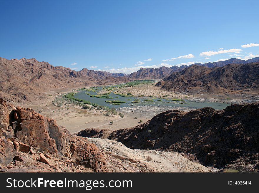 View of the Orange River in Namibia from a nearby mountain. View of the Orange River in Namibia from a nearby mountain