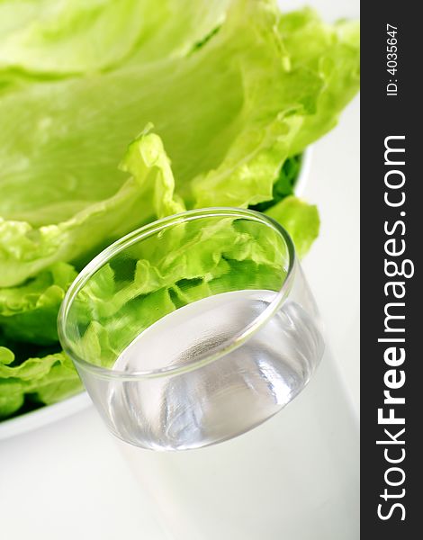 Fresh green salad with a glass of water. Fresh green salad with a glass of water