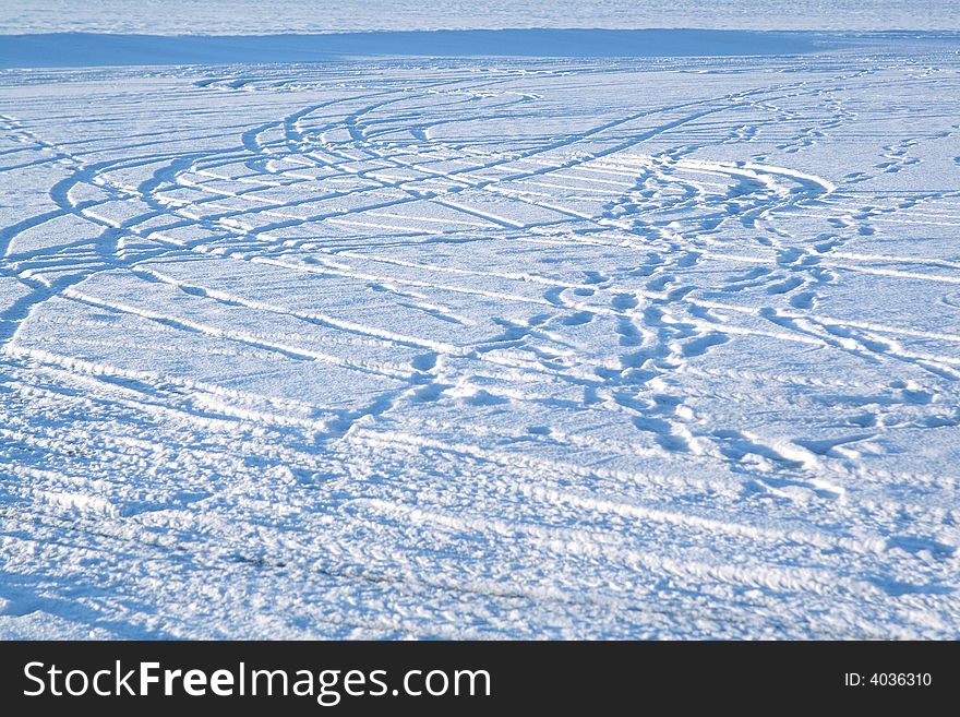 Abstract design - tire tracks in snow