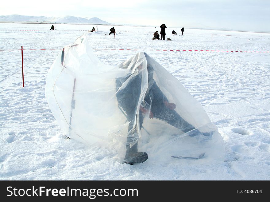 Fishing On Frozen Lake