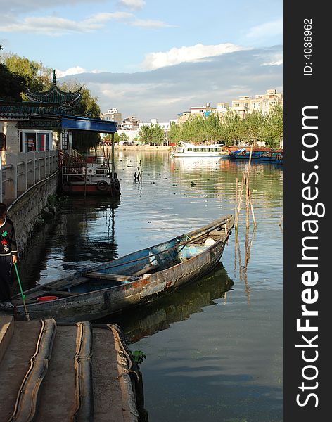 Boats in a park in China, some boats taat take passengers on tours, others used for fishing or cleaning the lake. Boats in a park in China, some boats taat take passengers on tours, others used for fishing or cleaning the lake