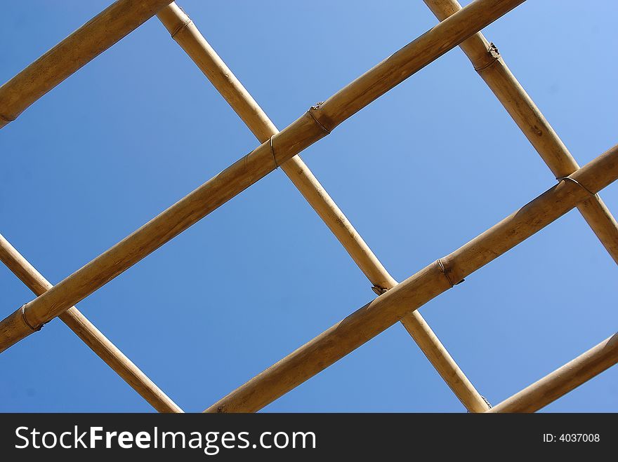 Bamboo net or fence behind sky