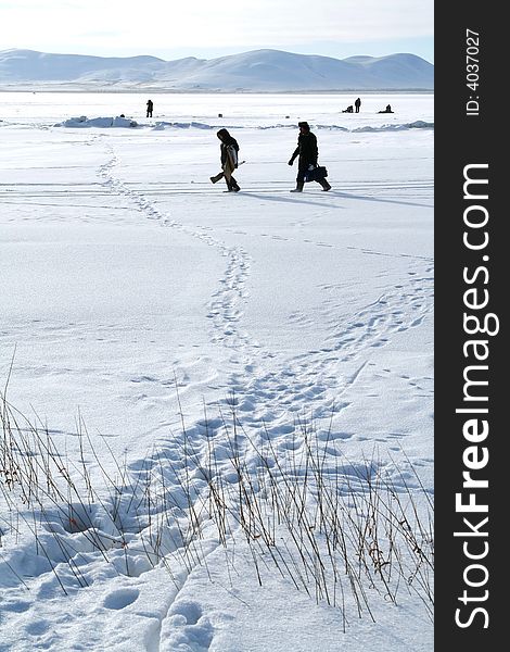 Winter Arctic landscape with fishermen. Winter Arctic landscape with fishermen
