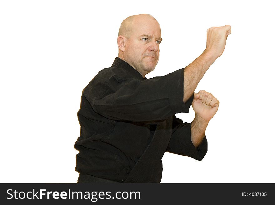 A black belt martial artist in a fighting stance