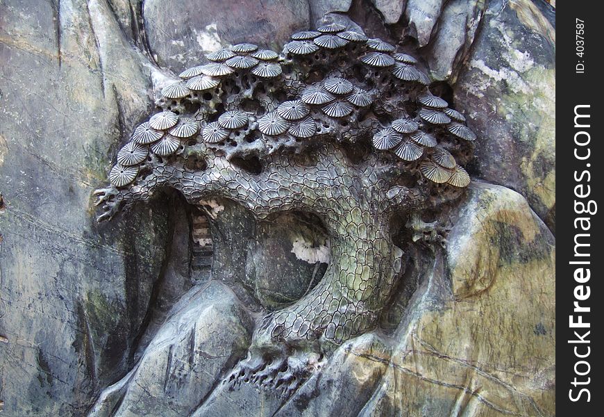 Carve pine on a stone in a temple