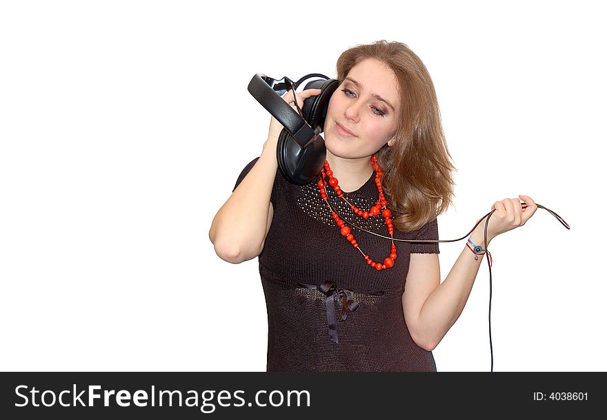 Beautiful young girl with headphones isolated over a white background