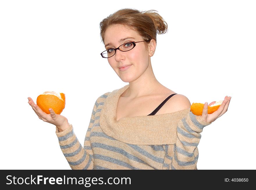 Beautiful young girl with orange isolated over a white background