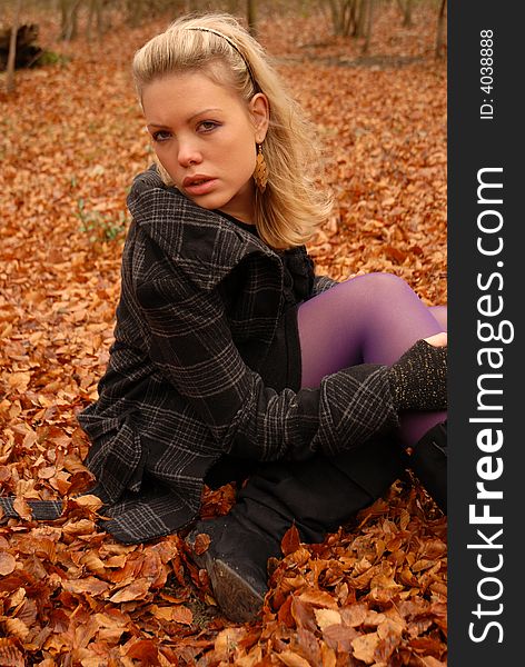 Portrait of Beautiful blonde in autumn setting. Portrait of Beautiful blonde in autumn setting.