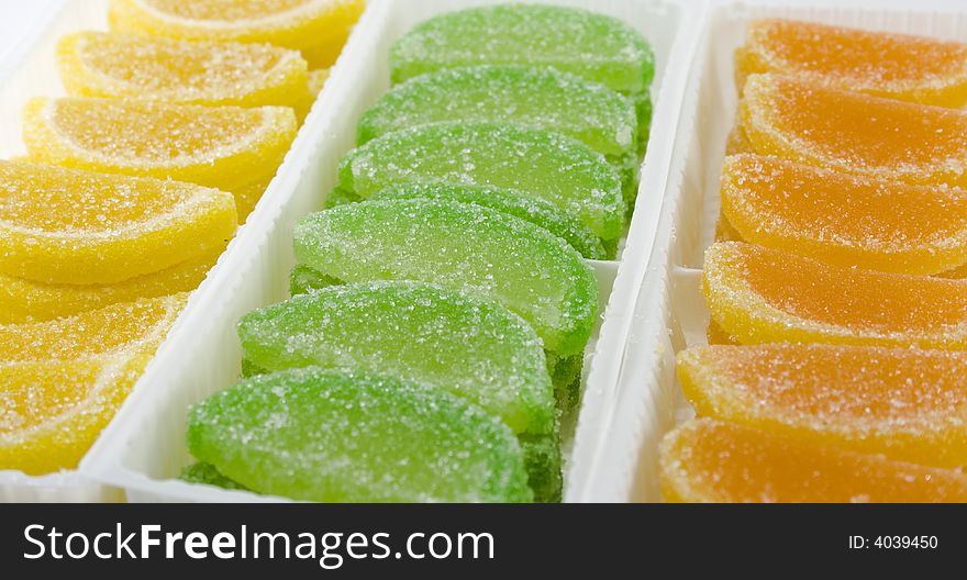 Clost-up of colourful fruit candies in boxes