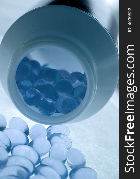 Blue capsules with oils and vitamins