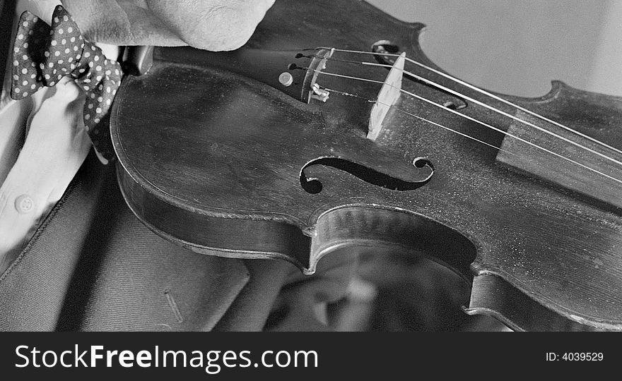 A musician with an old violin. A musician with an old violin.