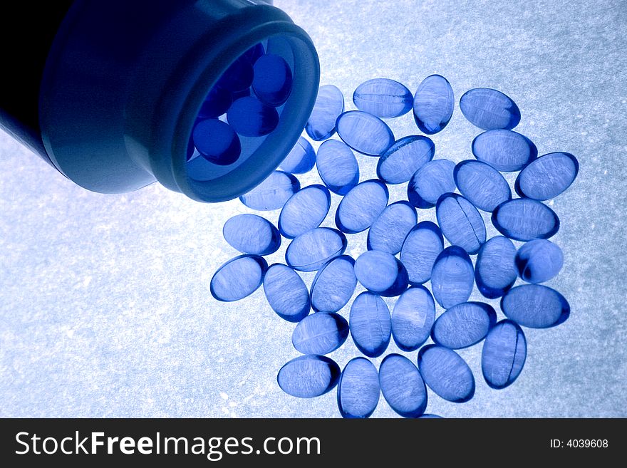 Blue capsules with oils and vitamins