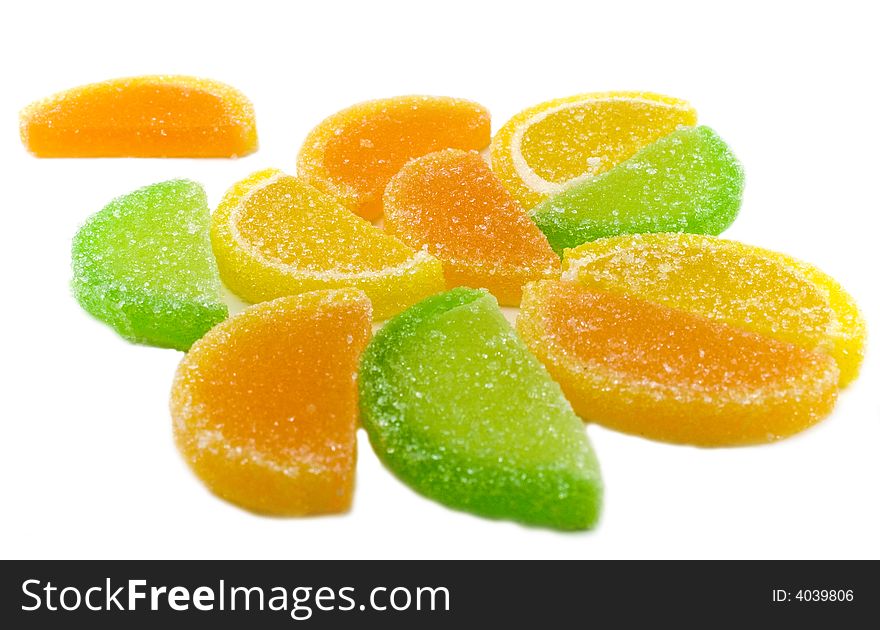 Colourful fruit candies isolated over white