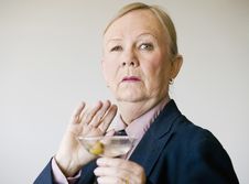 Dramatic Senior Woman With A Martini Stock Photo Dramatic Senior Woman With A Martini Stock Photo