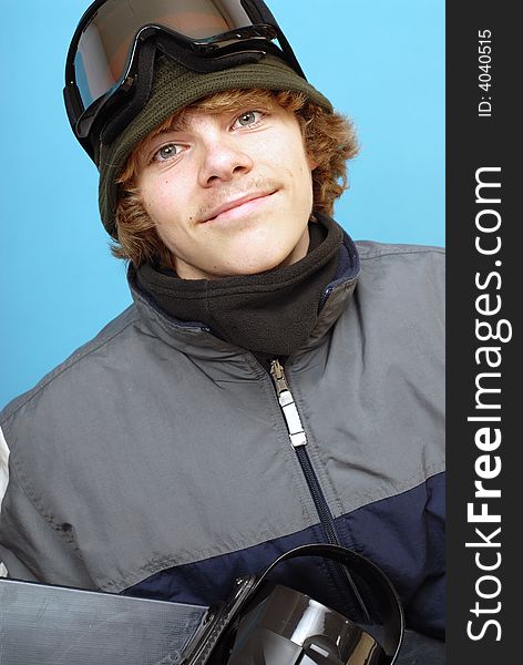 Happy and smiling teenage snowboarder in his gear. Happy and smiling teenage snowboarder in his gear