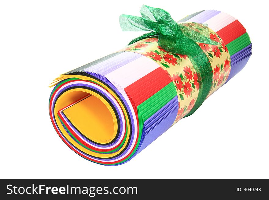Colored paper roll tied with a green ribbon