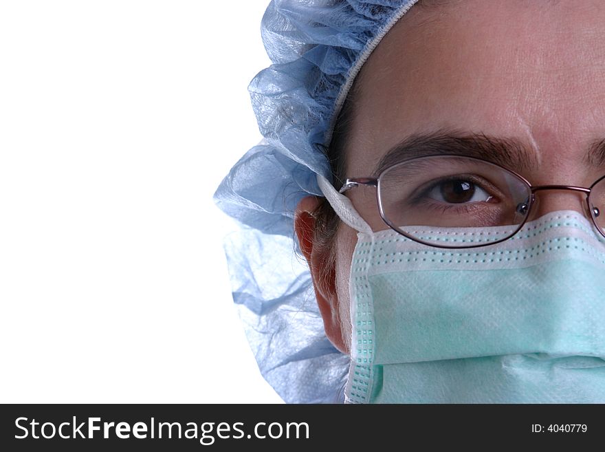 A closeup of a nurse or surgeon wearing a surgical mask on white background.