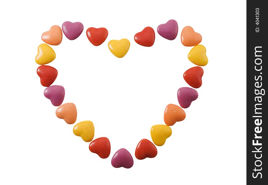 Heart shape made of small candy hearts isolated on white. Heart shape made of small candy hearts isolated on white