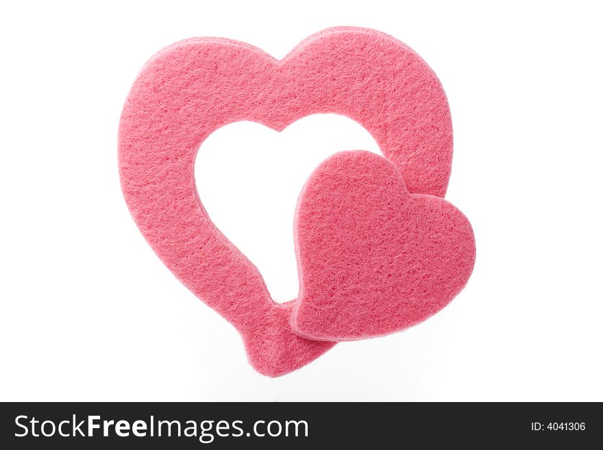 Two isolated pink soft hearts with white background. Two isolated pink soft hearts with white background