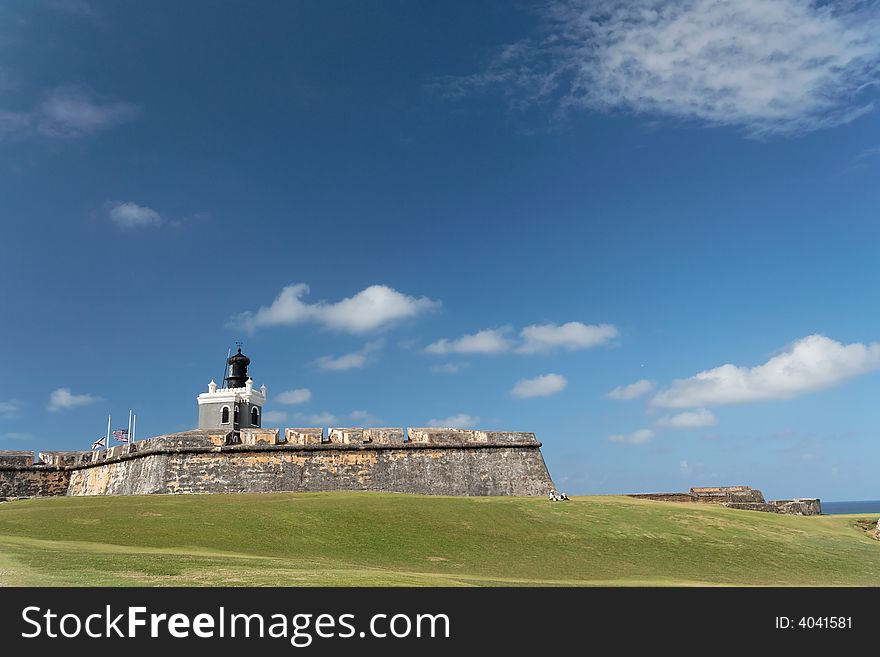 Panorama view of a historical caribbean fortress and lighthouse