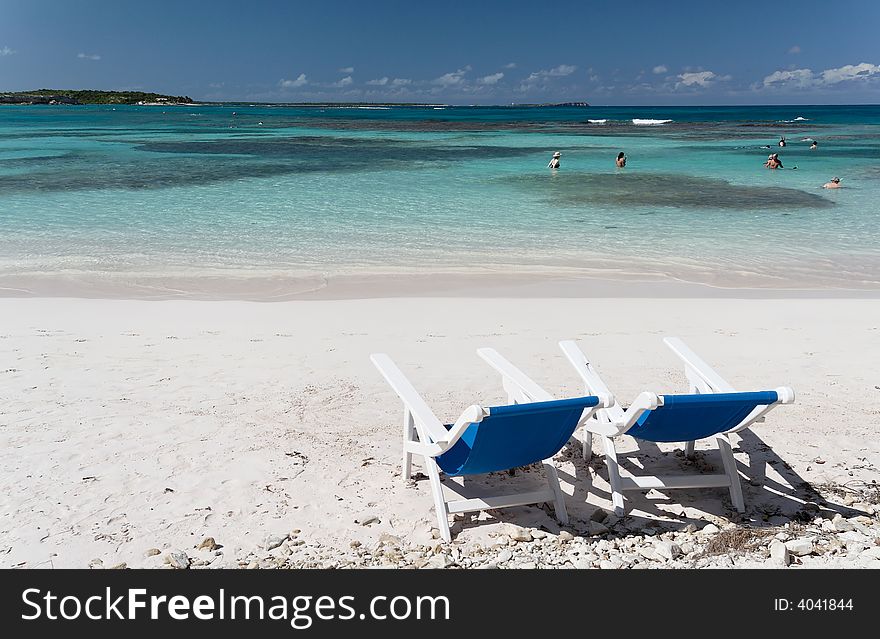 Canvas chairs on a beautiful caribbean beach. Canvas chairs on a beautiful caribbean beach