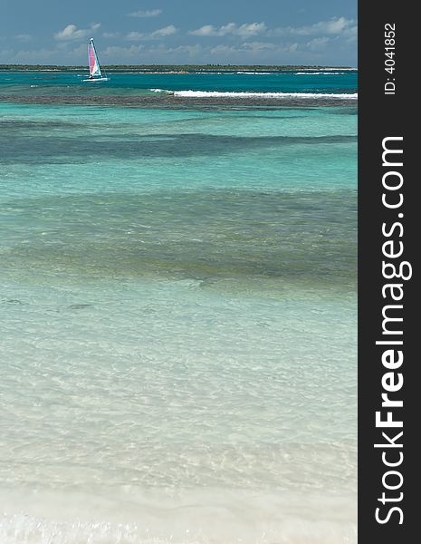 Blue caribbean water with sailing boat. Blue caribbean water with sailing boat