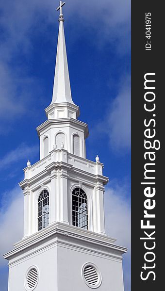 Elaborate church steeple on a sunny afternoon.