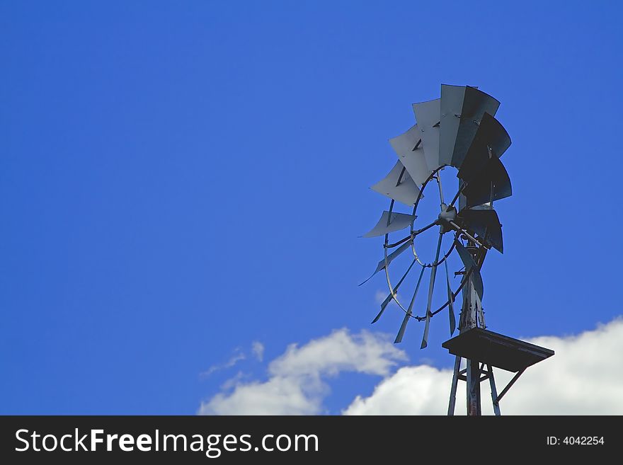 Farm wind mill blue sky