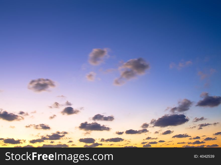 Sunset blue and orange glow and clouds