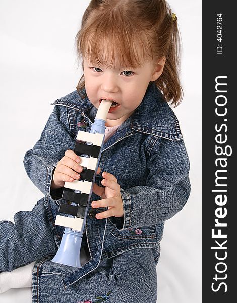 Girl plays on the pipe