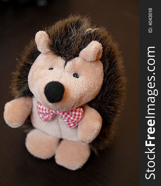 A A toy hedgehog  over black background