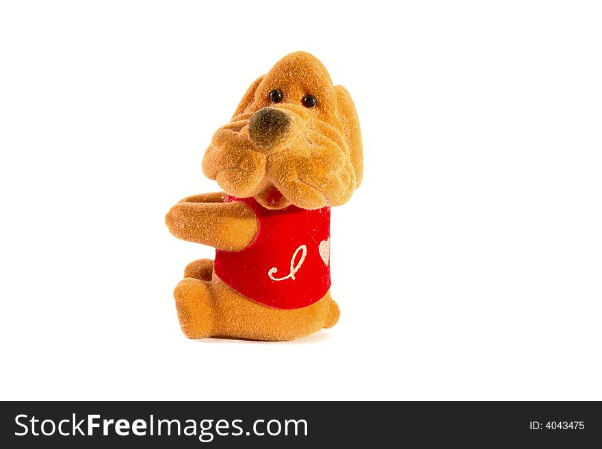 Isolated toy - sitting dog. It can holding something in its hands. Isolated toy - sitting dog. It can holding something in its hands.