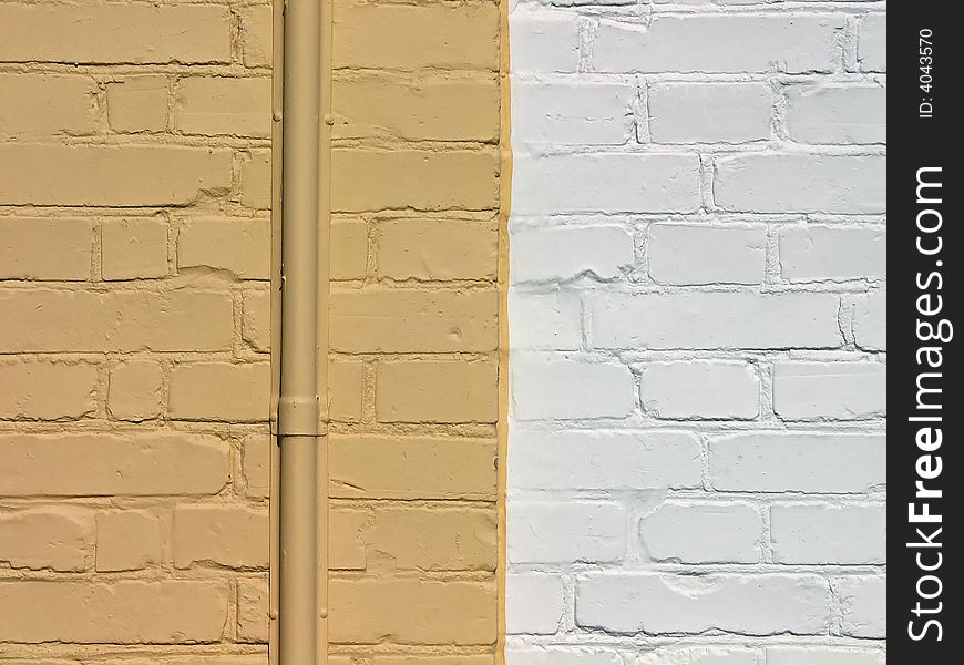 Wall made of painted yellow and white bricks. Wall made of painted yellow and white bricks