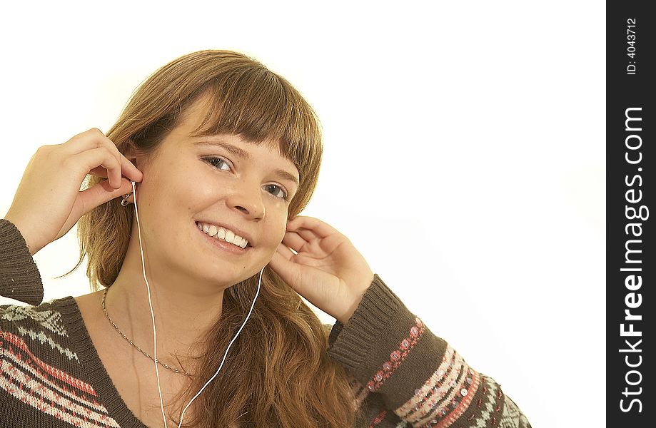 Young girl listening music and smiling. Young girl listening music and smiling