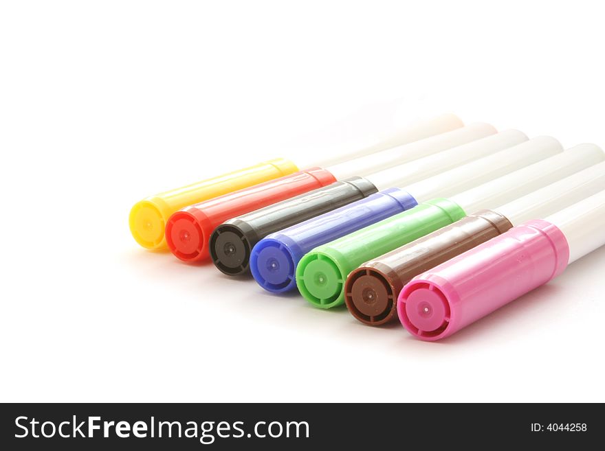 Row of colour markers on white background. Row of colour markers on white background