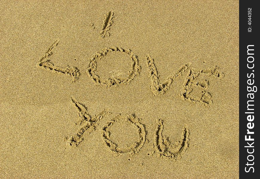 Love message written in sand on beach. Love message written in sand on beach