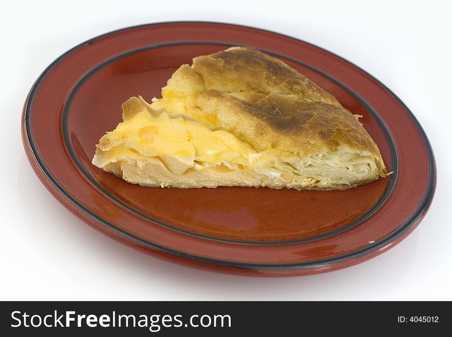 Baked pie piece with egg  isolated on white background