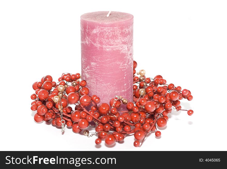 Pink candle in frame isolated on white