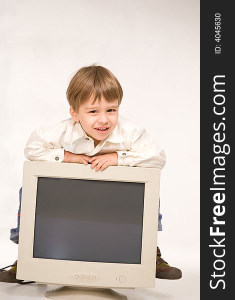 Little boy with computer monitor over white. Little boy with computer monitor over white