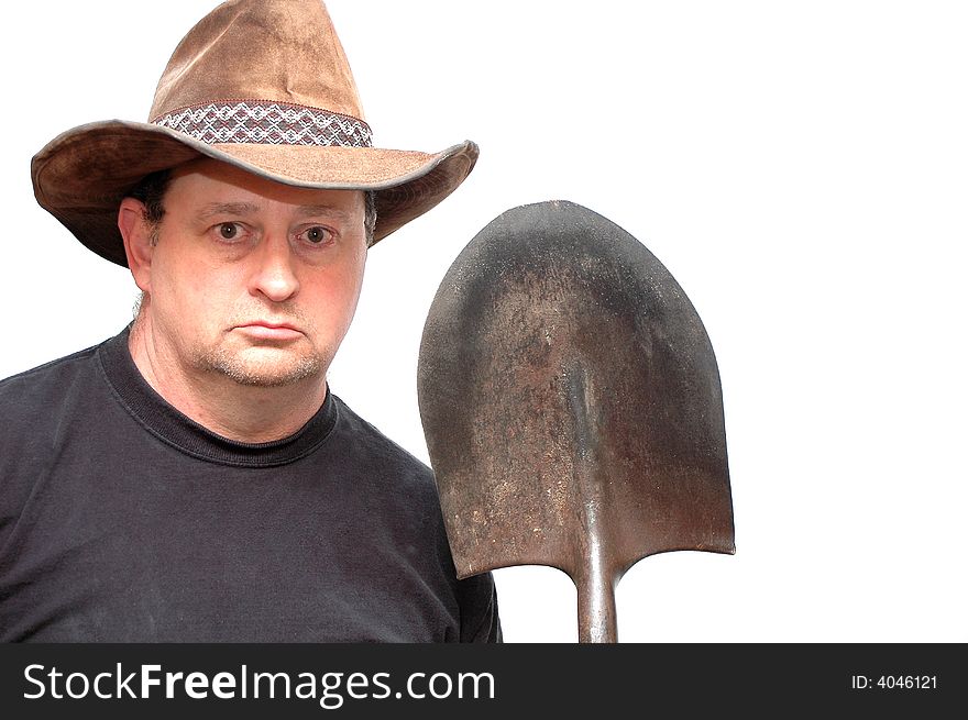 Man holding his shovel after a hard day. Man holding his shovel after a hard day.