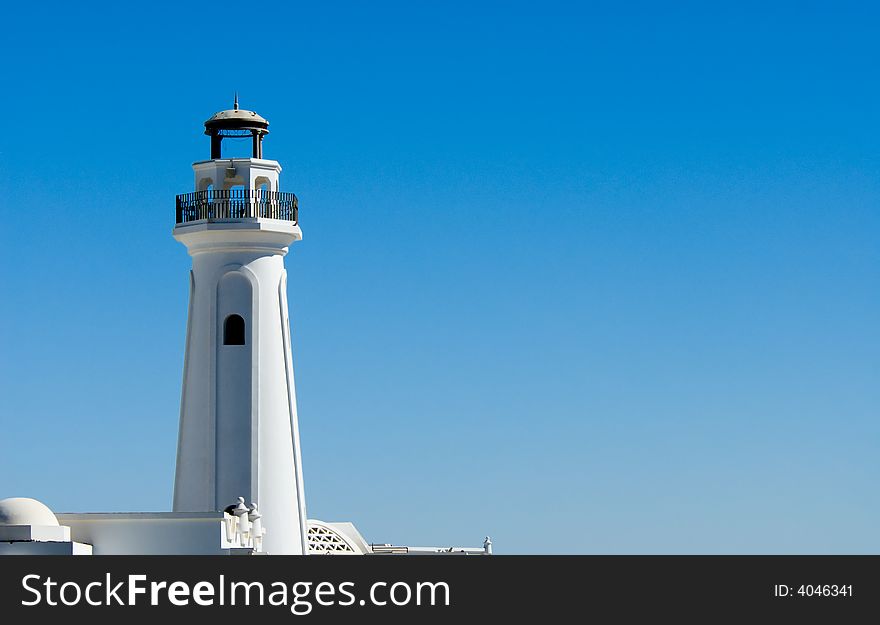 White lighthouse and blue sky