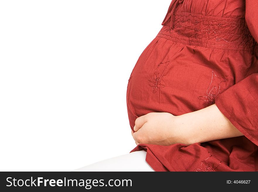 A pregnant lady holding her stomach with a white background