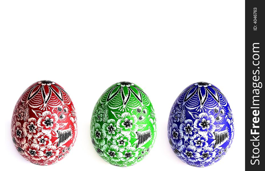Three colorful Easter eggs on white