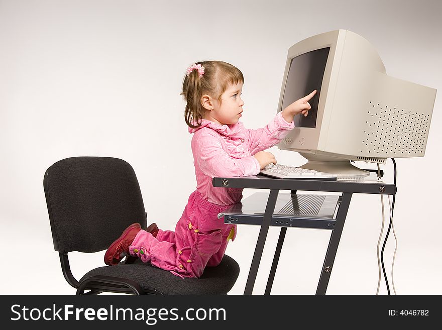Cute little girl with computer monitor. Cute little girl with computer monitor