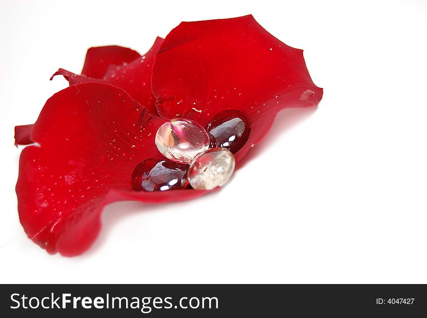 Decoration from deep red rose petals with glass stones