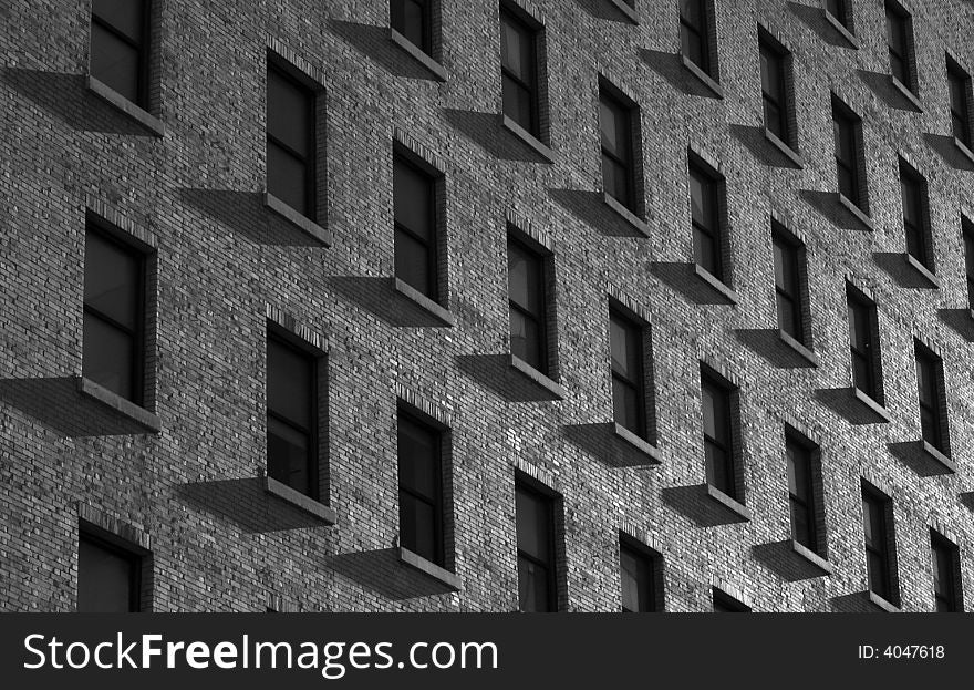 Windows and Shadows on an office building during sunrise/sunset. Windows and Shadows on an office building during sunrise/sunset.