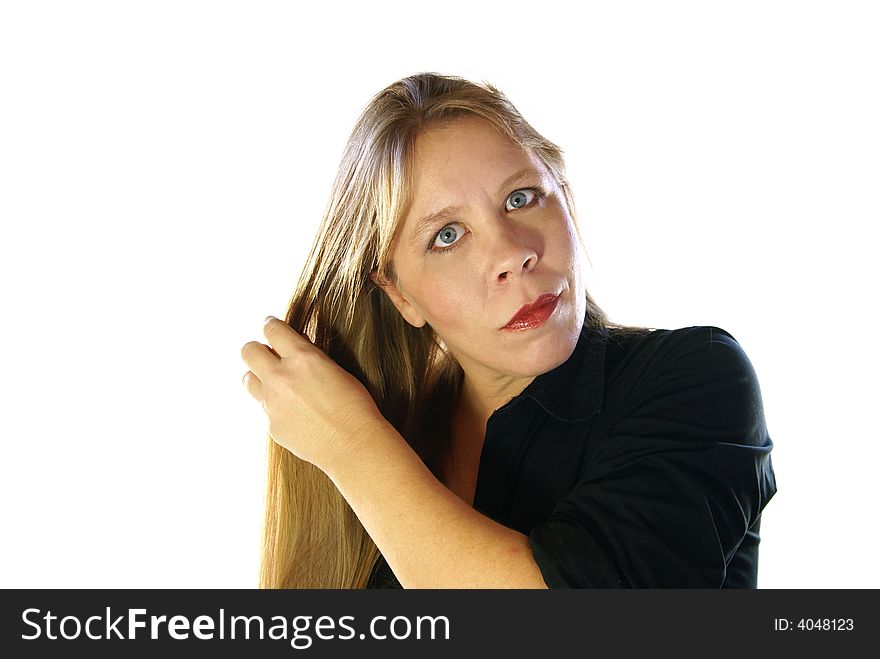 Attractive 30-40 year old woman brushing or fixing long gold blonde hair on white background. Attractive 30-40 year old woman brushing or fixing long gold blonde hair on white background.