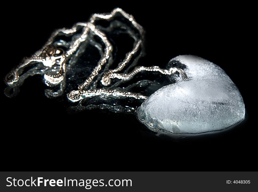 Ice heart on collar on black background